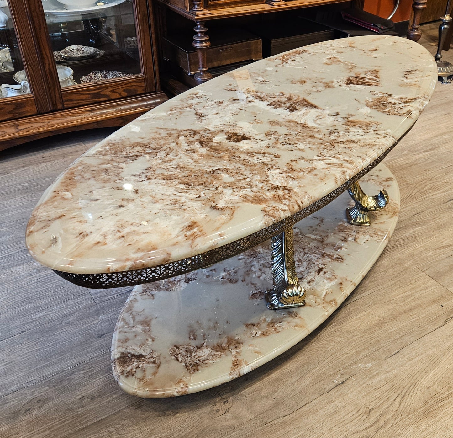 Oval coffee table, cultured marble and brass