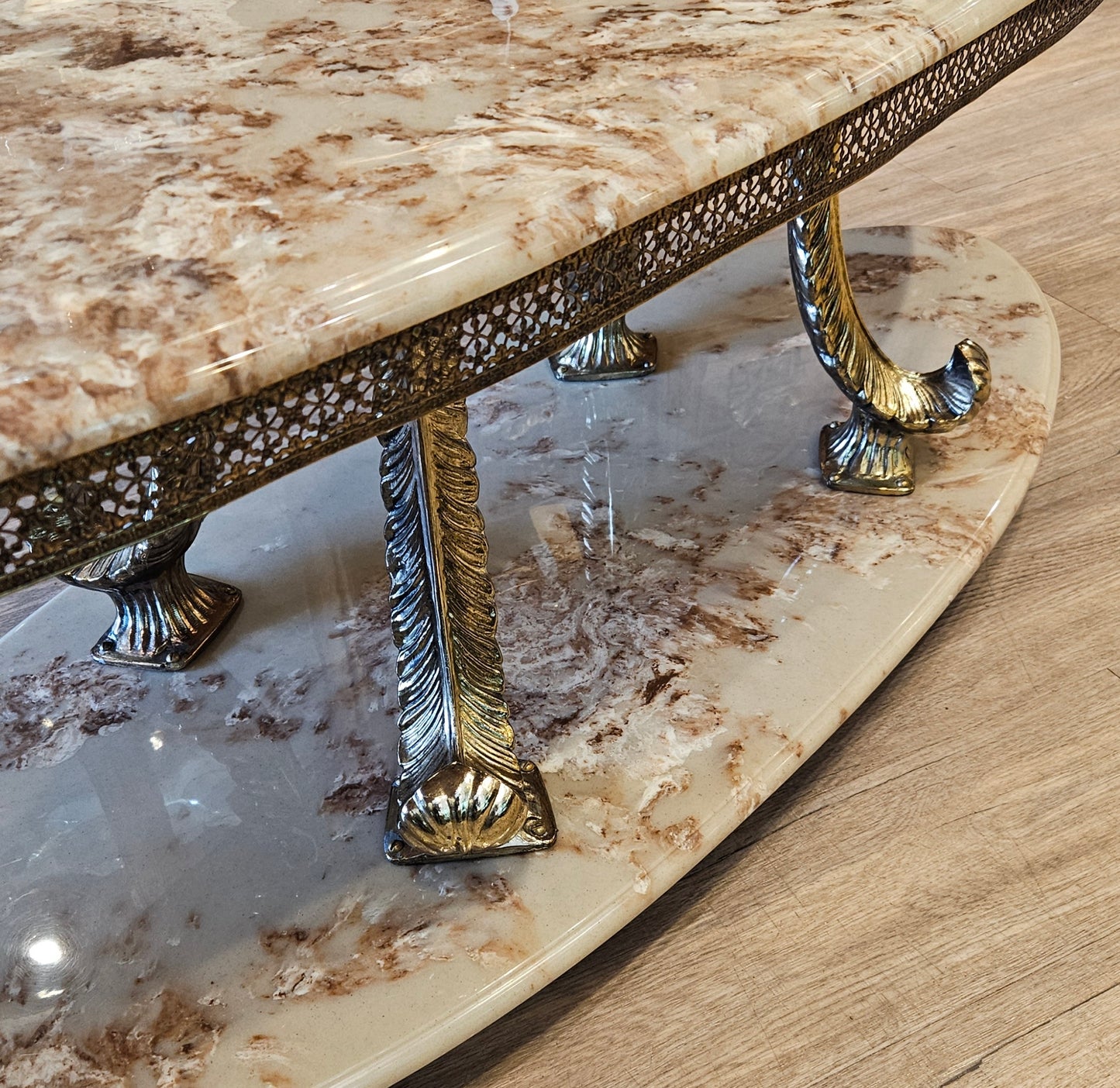 Oval coffee table, cultured marble and brass