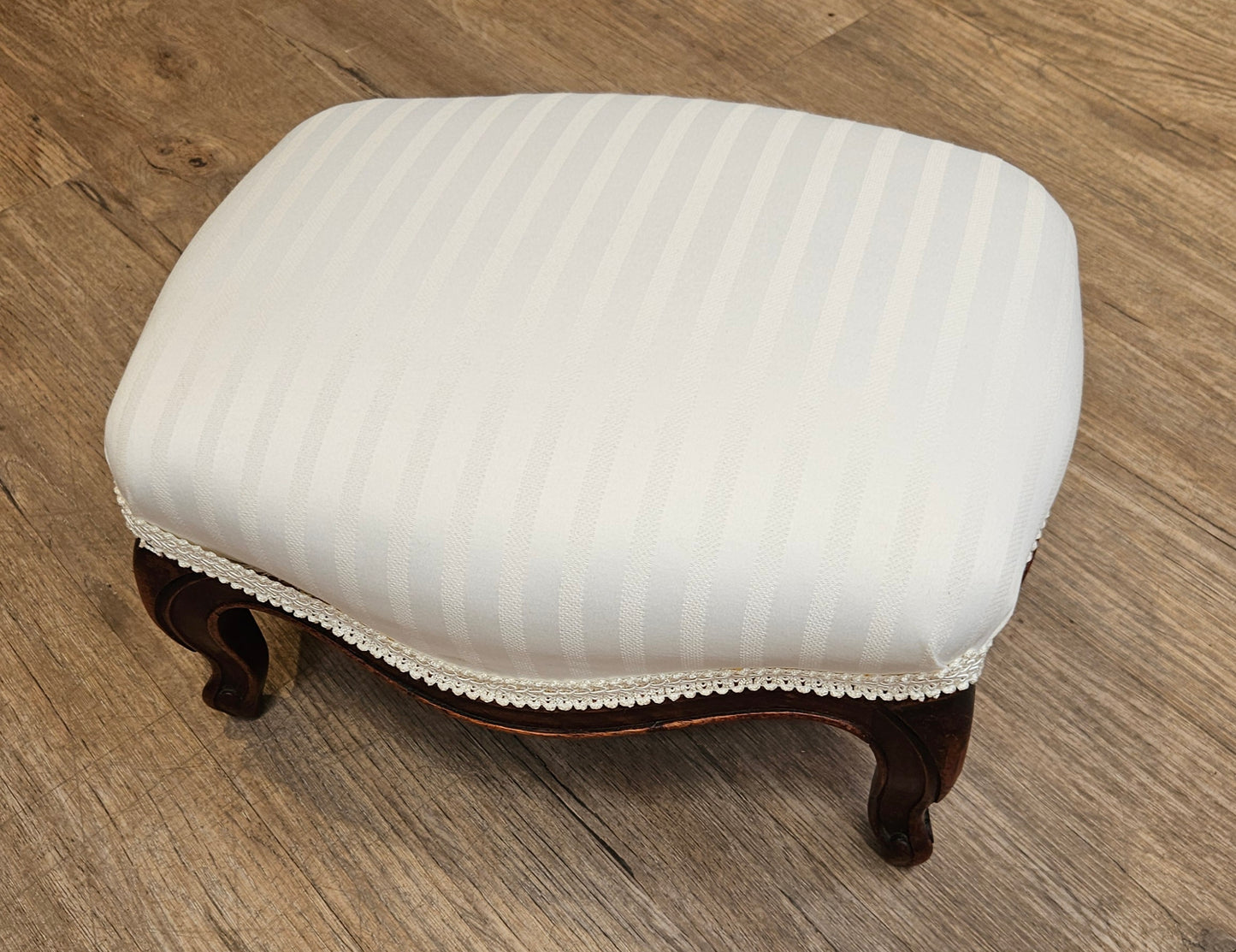 White upholstered foot stool