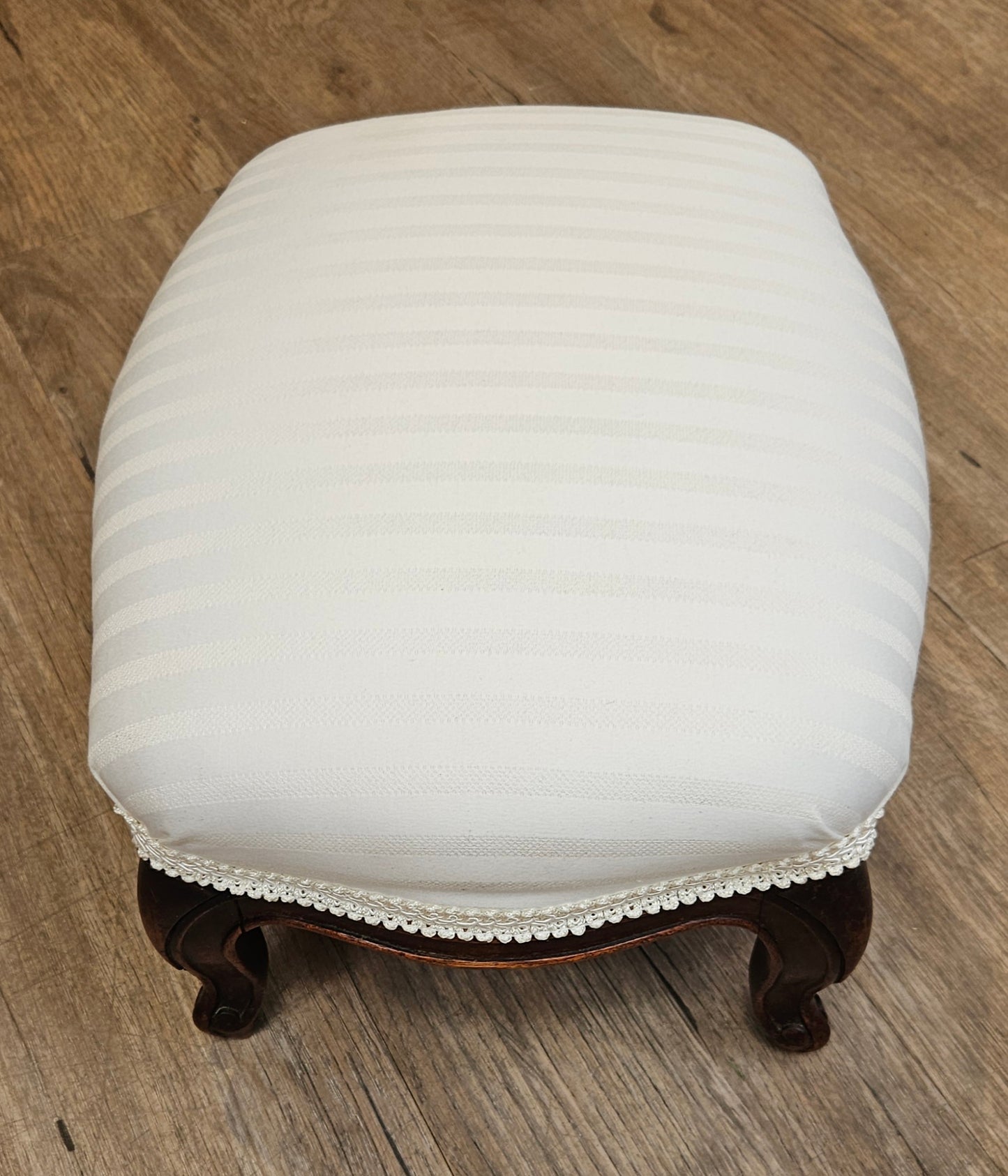 White upholstered foot stool