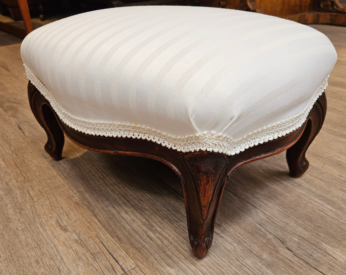 White upholstered foot stool