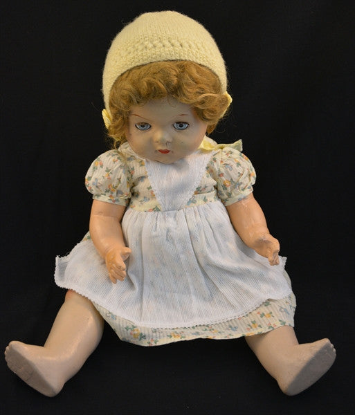 This vintage/antique Canadian Reliable doll comes with a yellow floral dress, apron, and adorable yellow knitted cap.
This vintage composition doll dates back to the 1920s.
It is in very good condition with some minor wear to her extremities commensurate with age.
Makes a "crybaby" sound when burped. Complete with closing grey eyes.
Measures 19" in height.
TY51377