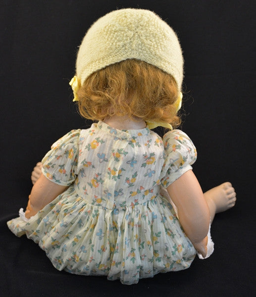 This vintage/antique Canadian Reliable doll comes with a yellow floral dress, apron, and adorable yellow knitted cap.
This vintage composition doll dates back to the 1920s.
It is in very good condition with some minor wear to her extremities commensurate with age.
Makes a "crybaby" sound when burped. Complete with closing grey eyes.
Measures 19" in height.
TY51377