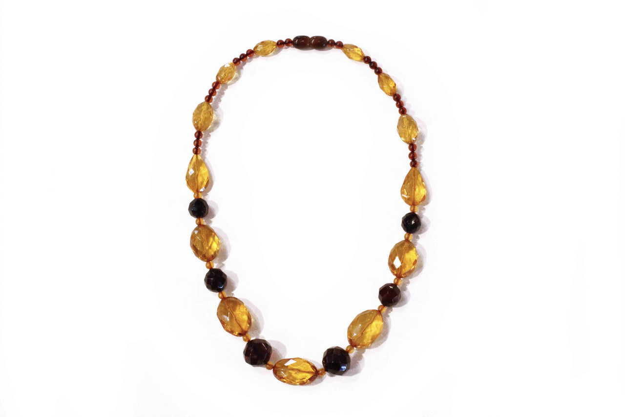 Faceted amber necklace of faceted amber beads in three colours.