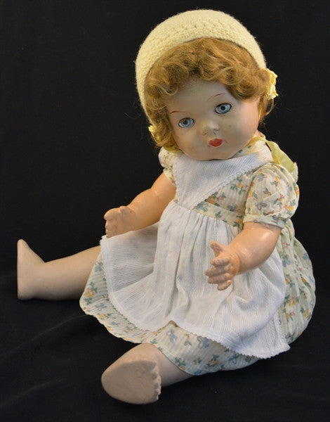 This vintage/antique Canadian Reliable doll comes with a yellow floral dress, apron, and adorable yellow knitted cap.
This vintage composition doll dates back to the 1920s.
It is in very good condition with some minor wear to her extremities commensurate with age.
Makes a "crybaby" sound when burped. Complete with closing grey eyes.
Measures 19" in height.
TY51377