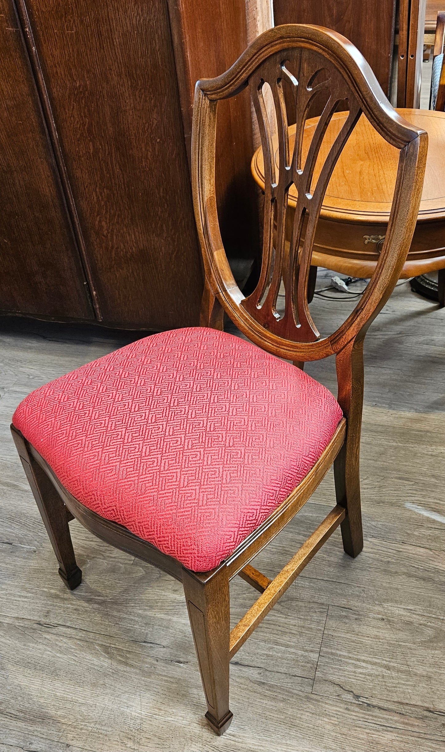Pink/red upholstered shield chair