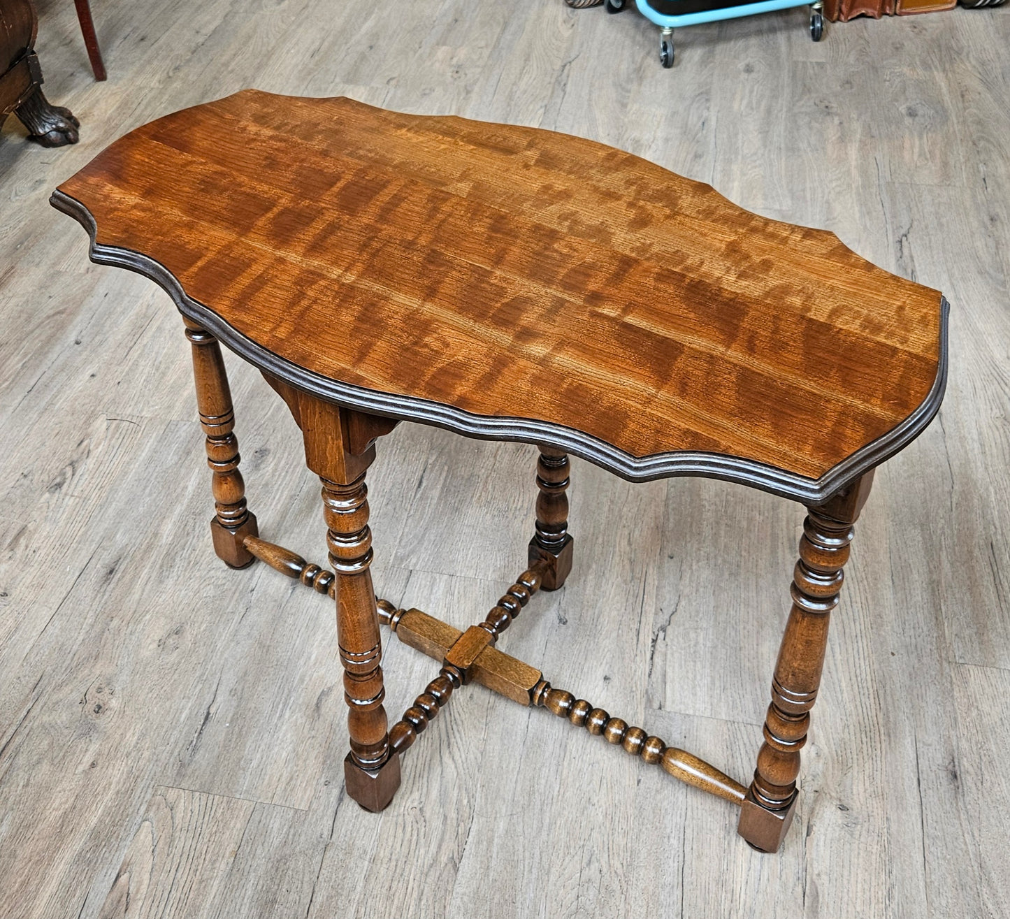 Oval sofa table, scalloped edges