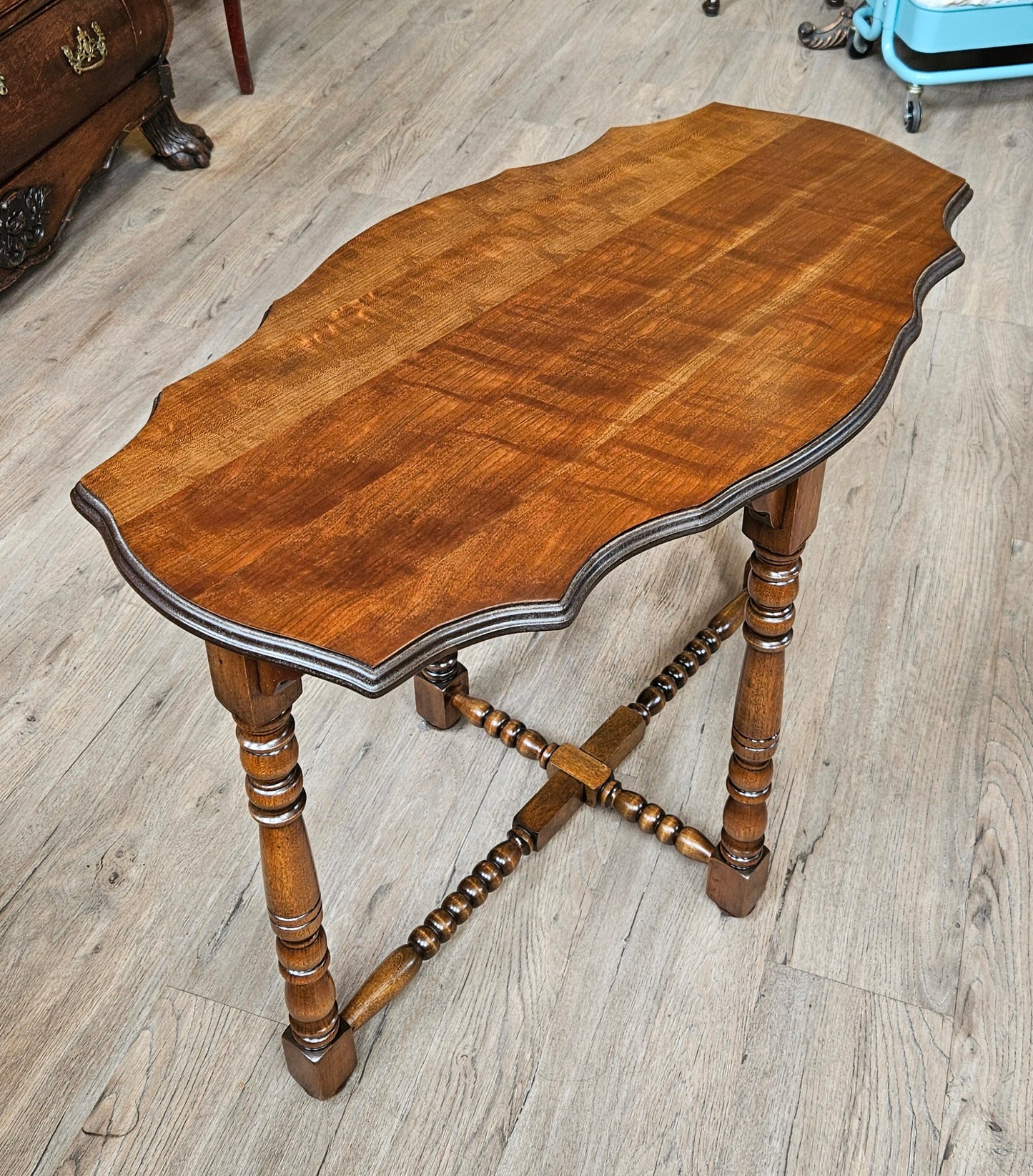 Oval sofa table, scalloped edges