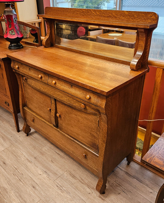 Oak sideboard with mirrored backsplash