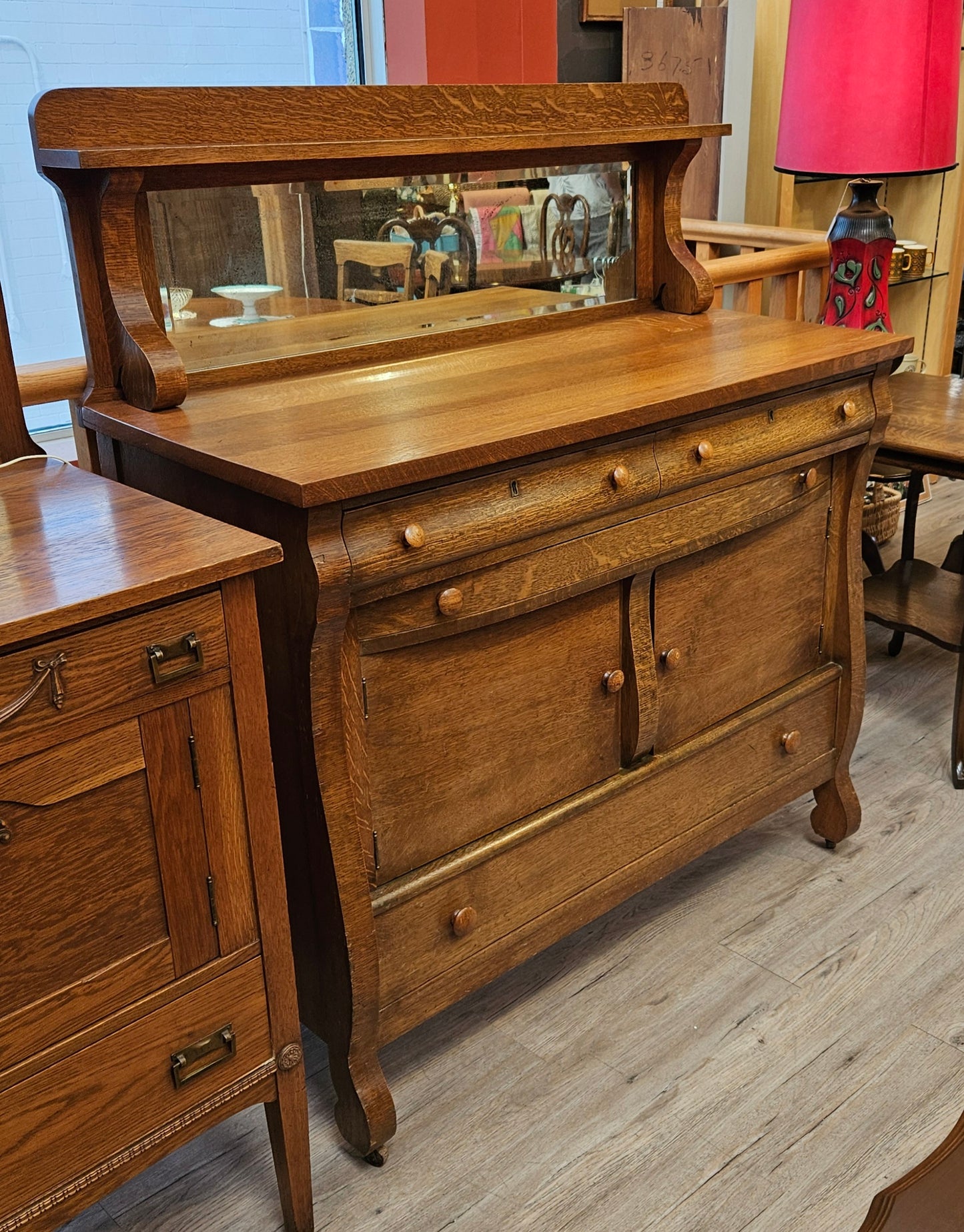 Oak sideboard with mirrored backsplash