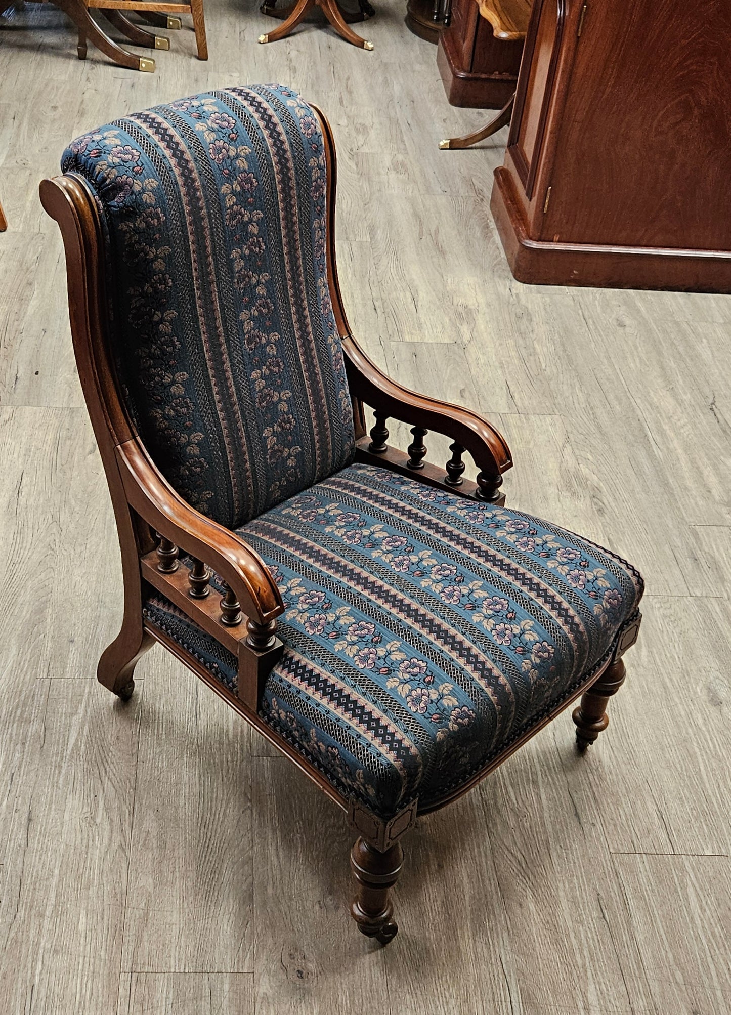 Pair of Victorian chairs on wheels, dark green striped upholstery