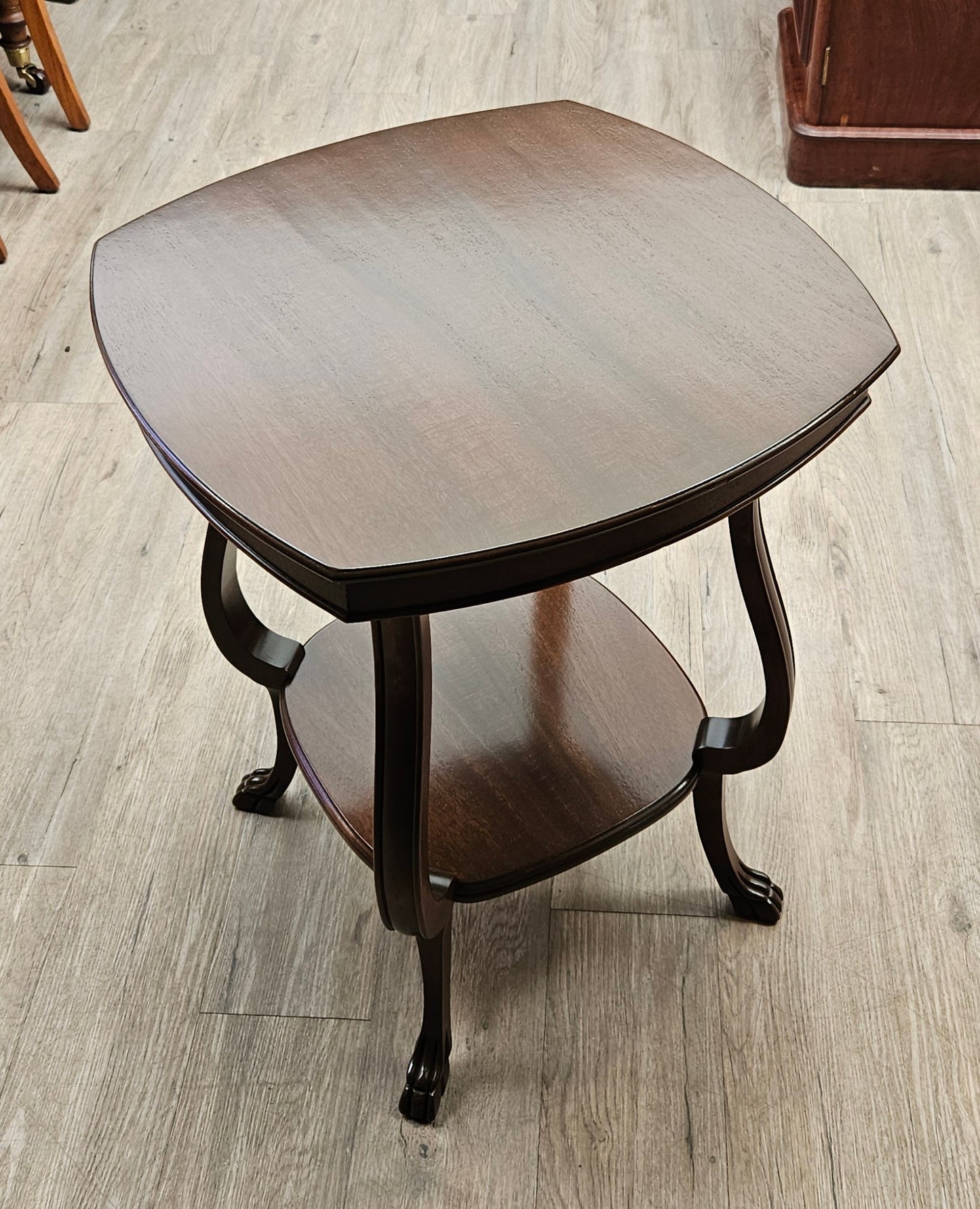 Squarish parlour table with shelf