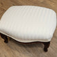 White upholstered foot stool