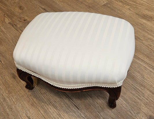 White upholstered foot stool