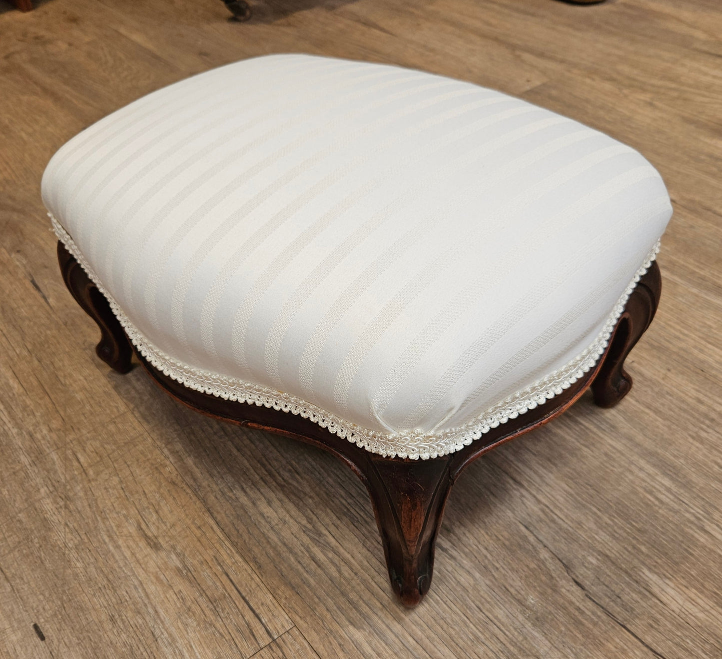 White upholstered foot stool