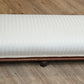 Low white upholstered fireside bench