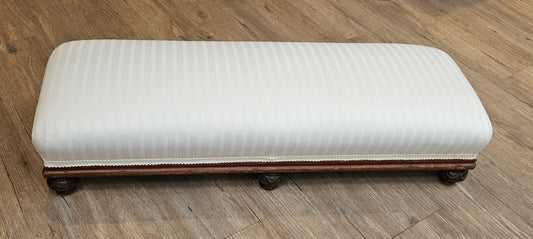 Low white upholstered fireside bench