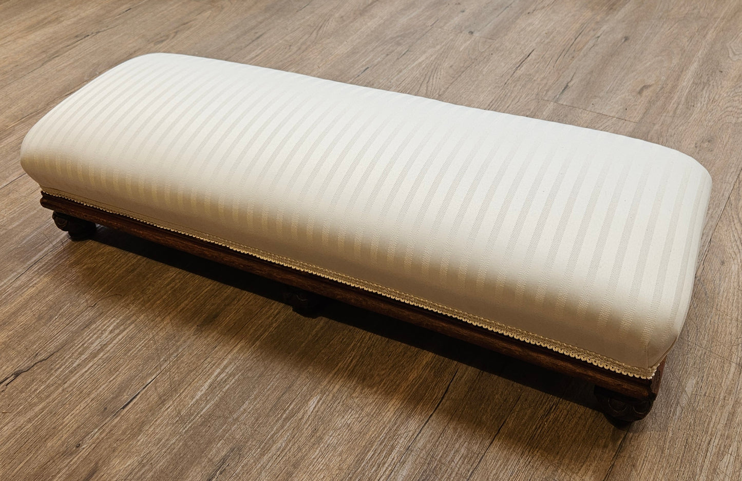 Low white upholstered fireside bench