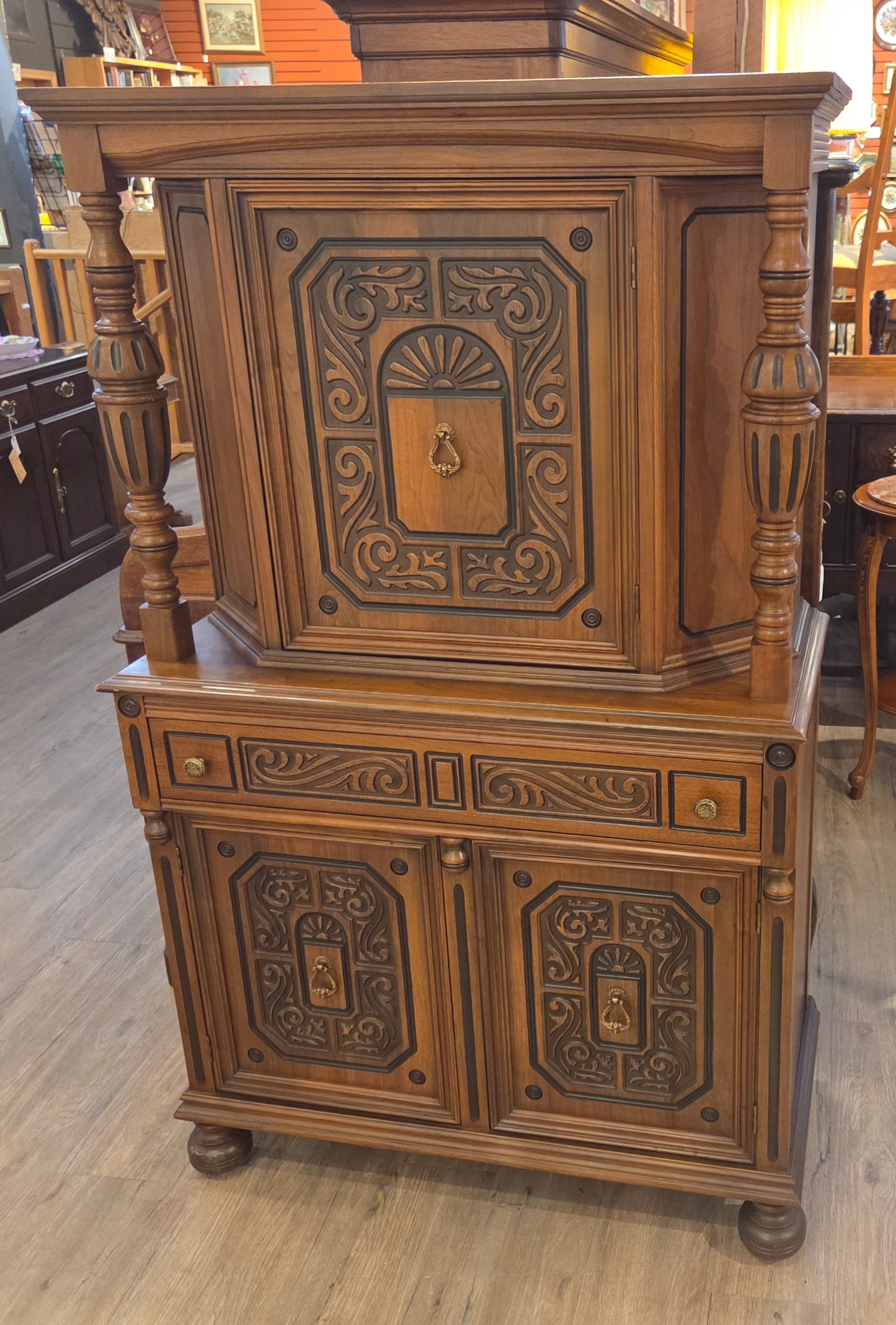 Walnut china cabinet, carved wood decorations on doors