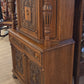 Walnut china cabinet, carved wood decorations on doors