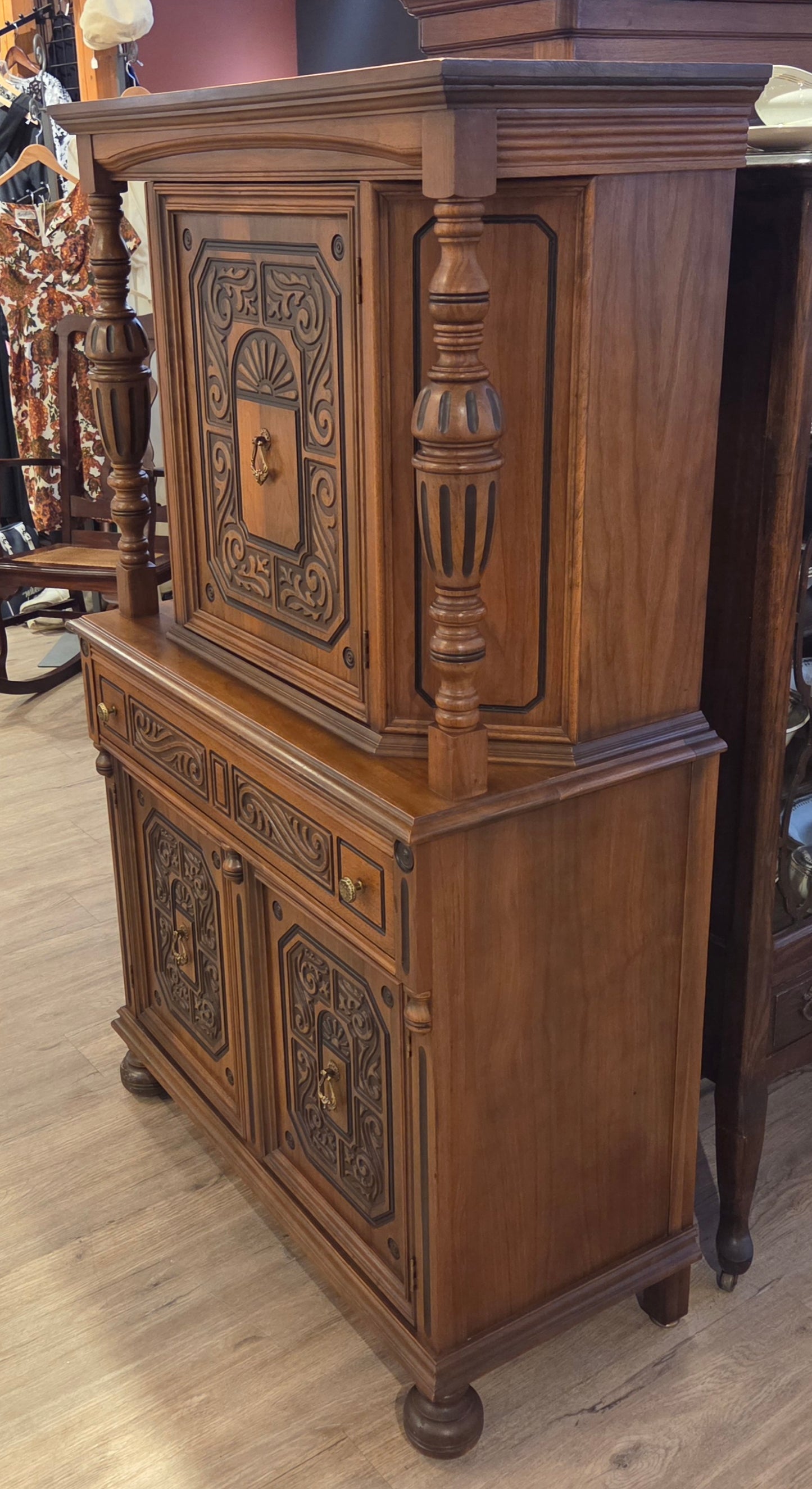 Walnut china cabinet, carved wood decorations on doors