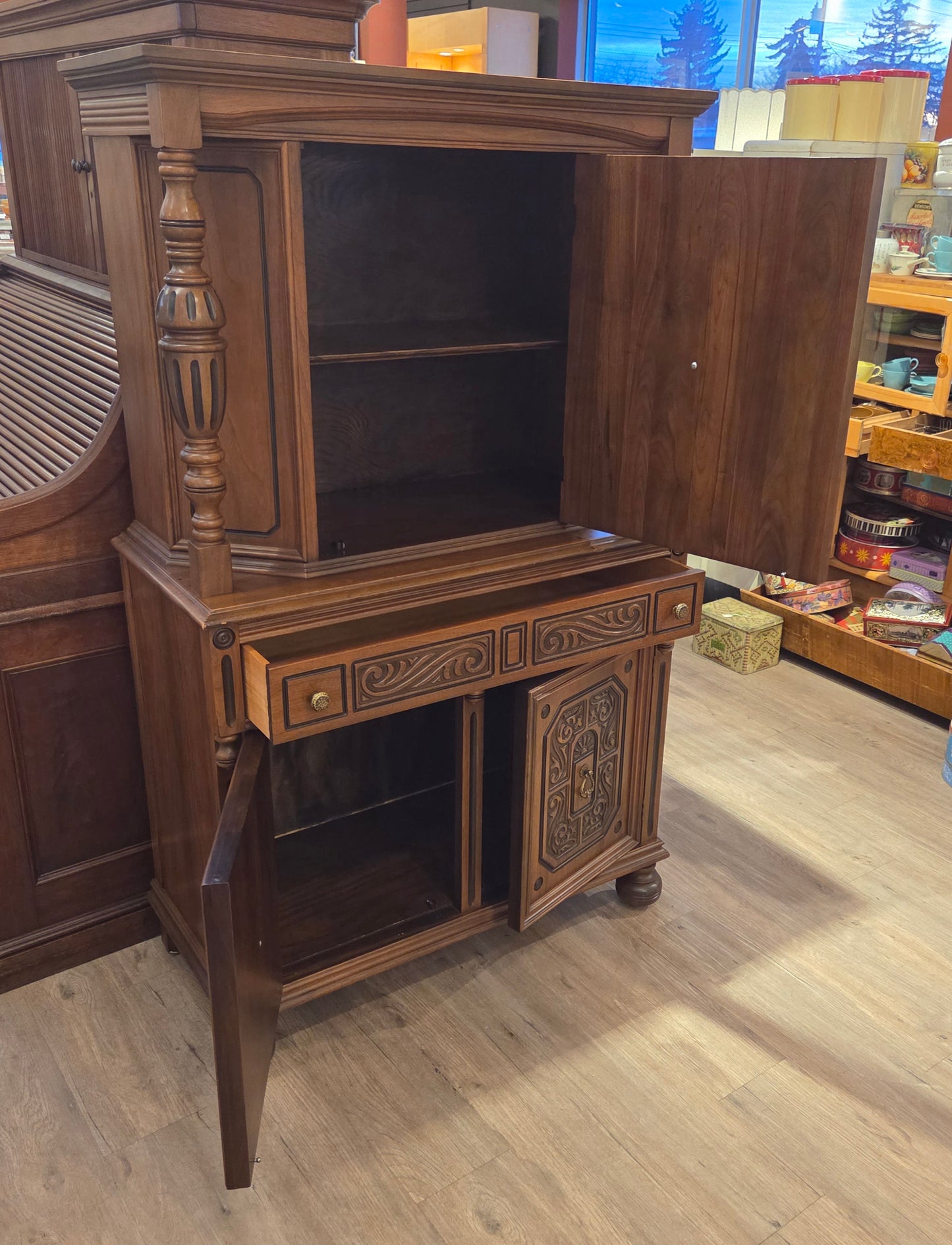Walnut china cabinet, carved wood decorations on doors