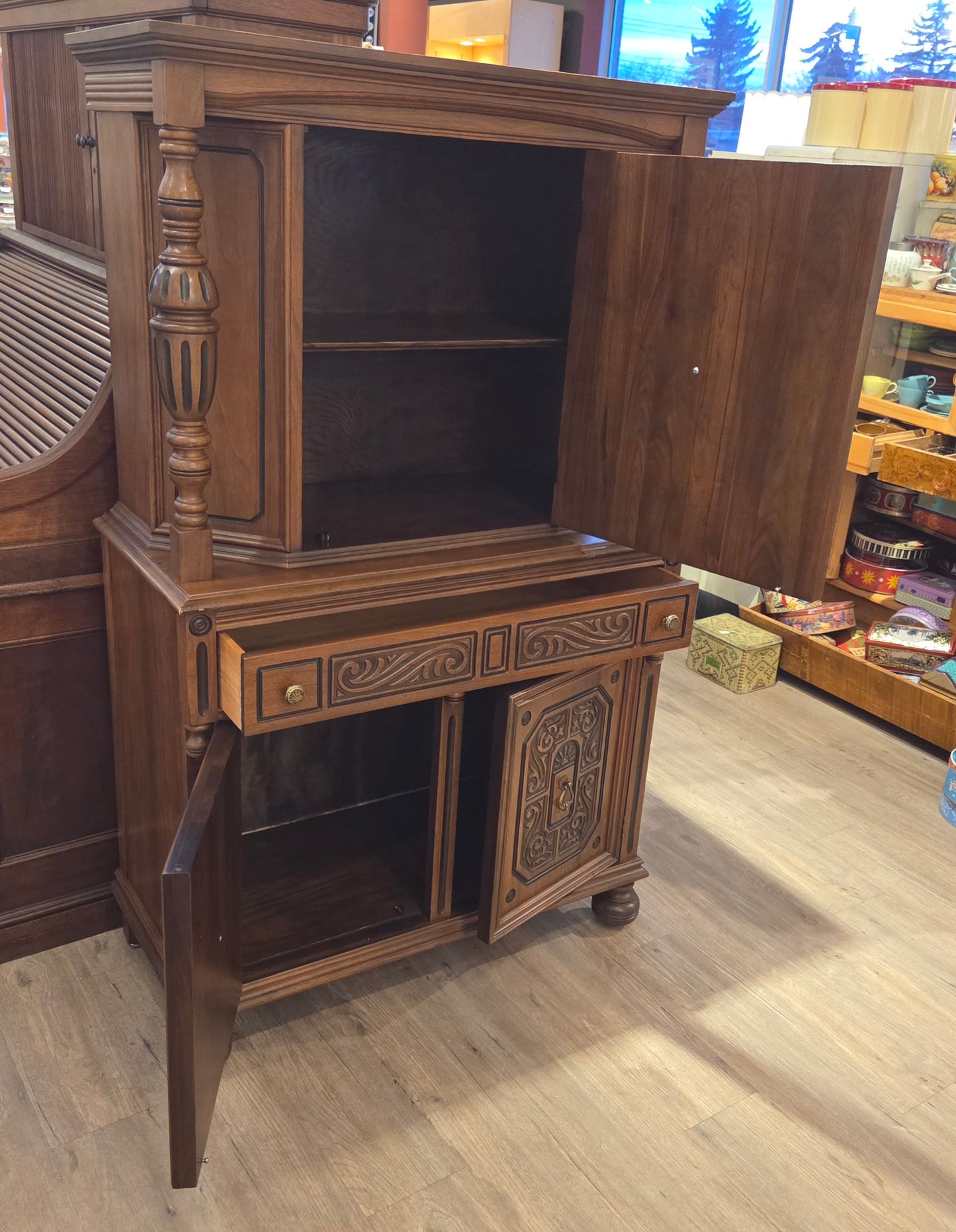 Walnut china cabinet, carved wood decorations on doors