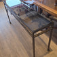 Sofa table, bronzed iron frame, bevelled glass top