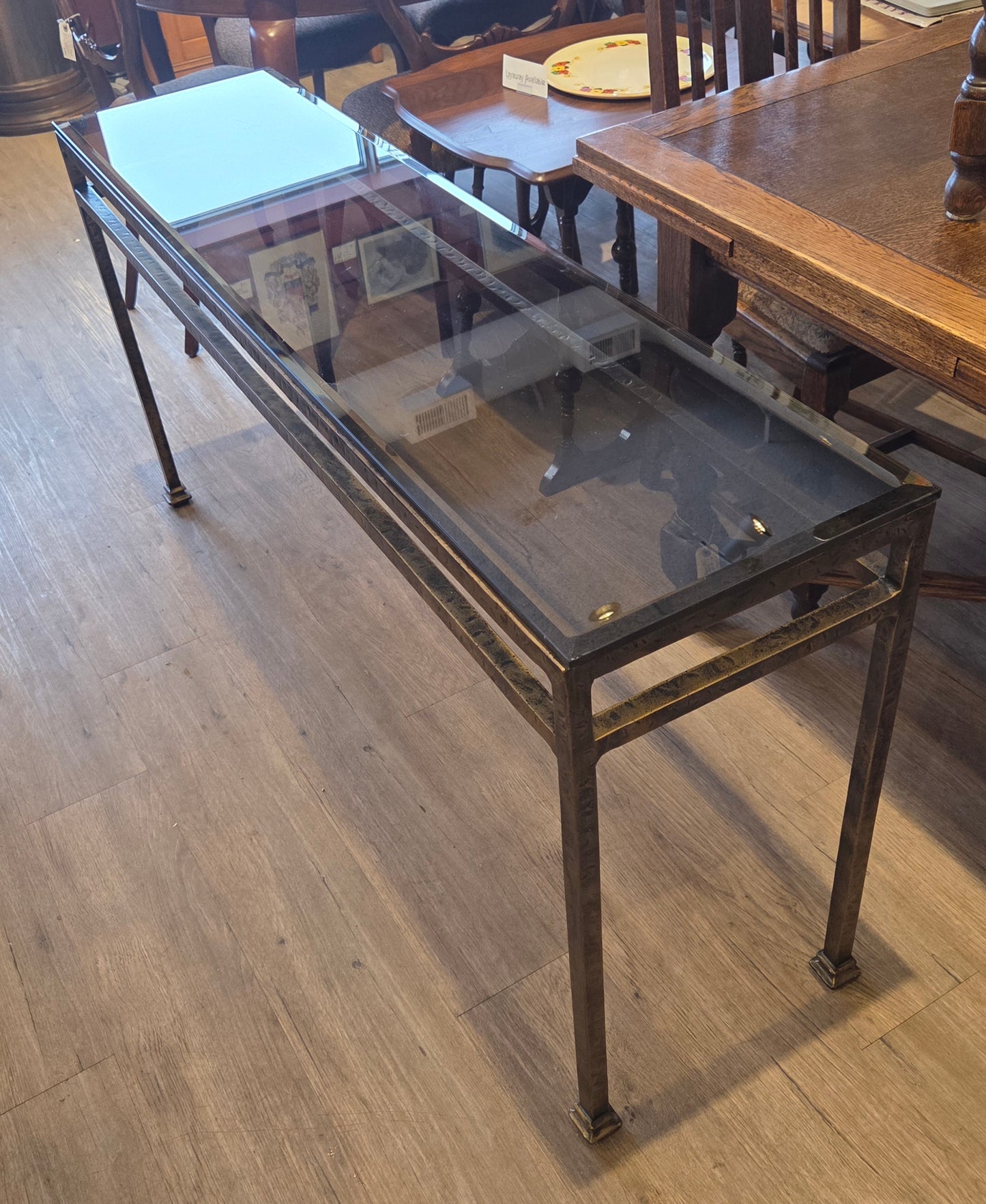 Sofa table, bronzed iron frame, bevelled glass top