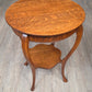 Round oak side table with shelf