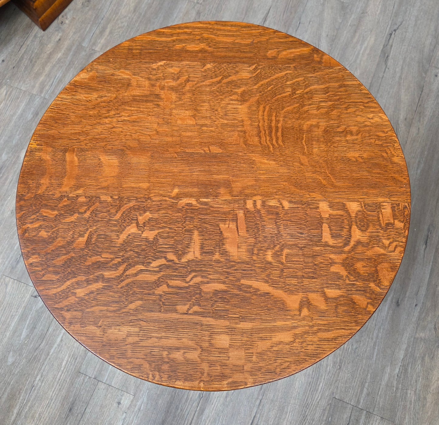 Round oak side table with shelf