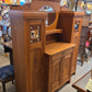 Break-front oak cabinet/entrance piece