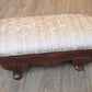 Oval antique mahogany footstool, cream coloured fabric