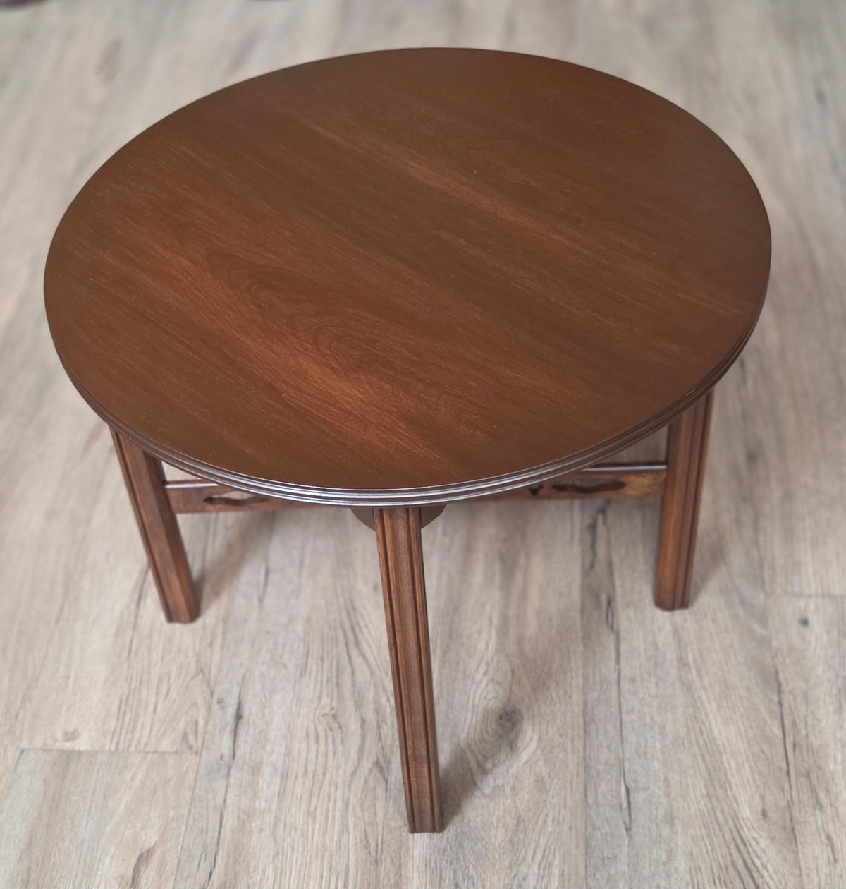 Round four legged coffee table