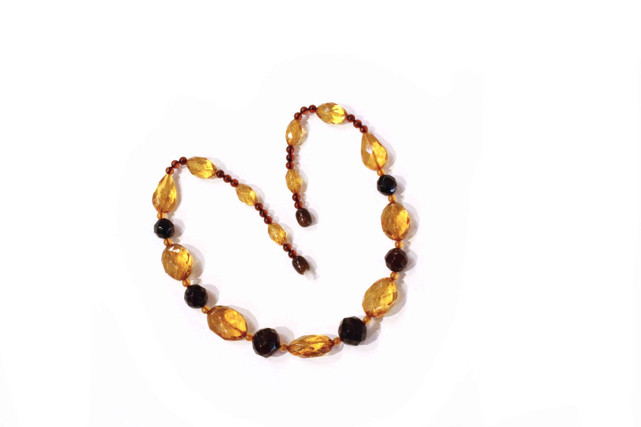 Faceted amber necklace of faceted amber beads in three colours.