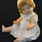 This vintage/antique Canadian Reliable doll comes with a yellow floral dress, apron, and adorable yellow knitted cap. 

This vintage composition doll dates back to the 1920s.   

It is in very good condition with some minor wear to her extremities commensurate with age.

Makes a "crybaby" sound when burped.  Complete with closing grey eyes. 

Measures 19" in height. 

TY51377