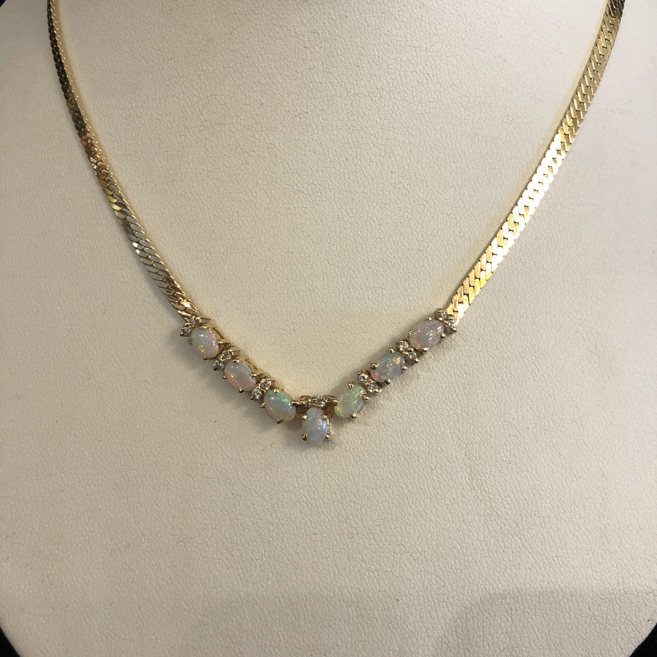 A Opal and Diamond Yellow 14K Gold Necklace.

Gorgeous with seven colourful opals and multiple pretty diamonds.

Accompanied by an independent gemological appraisal which says it all.

A great investment and lovely to wear.

JN64225

Ibon Antiques
10423 79 Avenue  in Edmonton's Old Strathcona neighborhood.